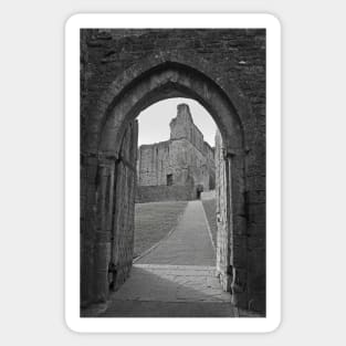 An ancient gateway in Chepstow castle offers views of the interior courtyard. Sticker